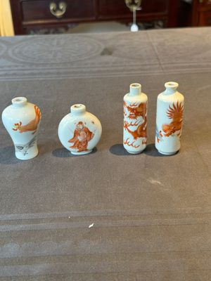 Three Chinese iron-red snuff bottles and one polychrome snuff bottle, Qianlong and Jie Mei Ya Zhi 介眉雅製 mark, 19th C. — photo 1