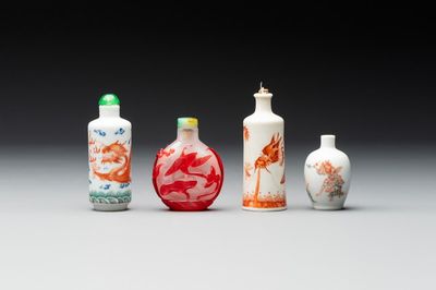Three Chinese porcelain snuff bottles and a red Peking glass snuff bottle, Daoguang and Tongzhi mark, 19th C.