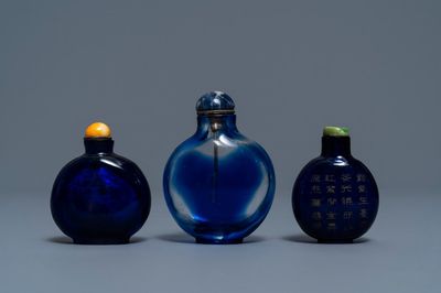 Three Chinese transparent blue glass snuff bottles, one inscribed, 18/19th C.