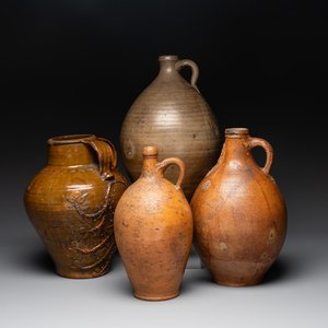 Three German stoneware jugs, including a bellarmine, and a French or English pottery jug, 17th C. and later — photo 1