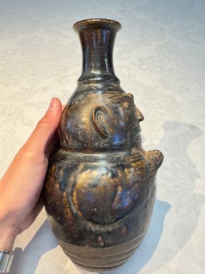 Three khmer-style brown-glazed anthropomorphic gourd-form bottles, probably 12/13th C. — photo 27