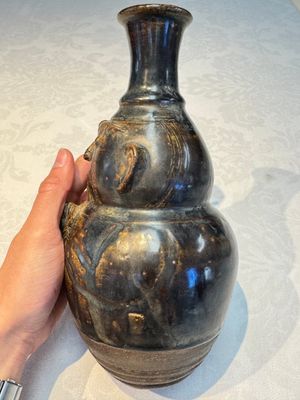 Three khmer-style brown-glazed anthropomorphic gourd-form bottles, probably 12/13th C. — photo 29