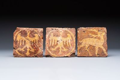 Three medieval slip-decorated tiles with eagles and a stag, England, 15th C.