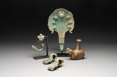Three palanquin hooks, a bronze sculpture of naga Mucalinda and an elephant-form kendi, Cambodia, 13th C. and earlier