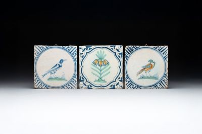 Three polychrome Dutch Delft 'flower' and 'bird' tiles, 17th C.