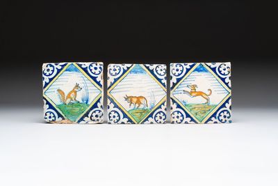 Three polychrome Dutch Delft maiolica 'fox', 'bull' and 'dog' tiles, late 16th C.