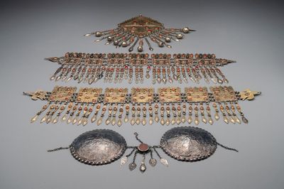 Three silver head ornaments and a chest ornament, Turkmenistan, 19/20th C.