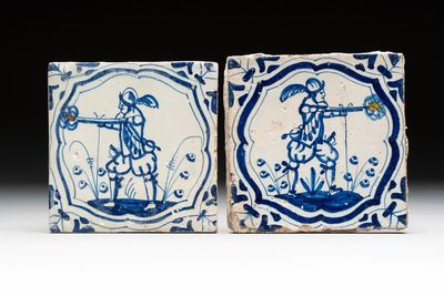 Two blue and white Dutch Delft 'soldier with coloured flame' tiles, 17th C.