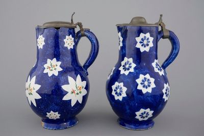 Two Brussels faience blue ground pewter-mounted jugs, 18th C.