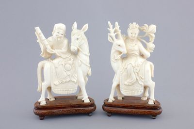 Two carved ivory figures of Chinese immortals on deers, ca. 1920