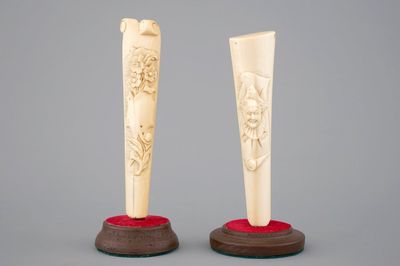 Two carved ivory umbrella or parasol handles, Dieppe (?), 19th C.