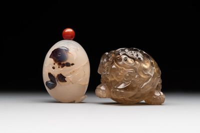 Two Chinese agate snuff bottles in the form of a bird and a pekinese, 19th C.