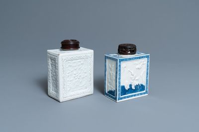 Two Chinese blanc de Chine and blue and white relief-moulded tea caddies, 19th C.