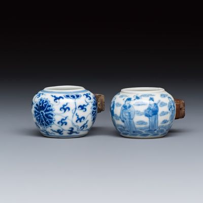 Two Chinese blue and white bird feeders with lotus scroll design and the Eight Immortals, Qianlong mark, 19th C.