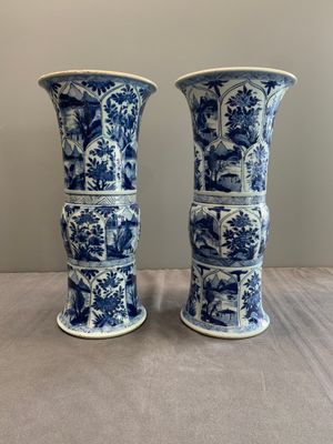 Two Chinese blue and white 'gu' vases with landscape and floral panels, Kangxi — photo 1
