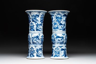 Two Chinese blue and white 'gu' vases with landscape and floral panels, Kangxi
