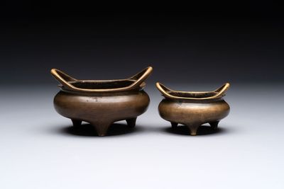 Two Chinese bronze tripod censers, Xuande marks, 19th C.