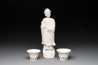 Two Chinese Dehua blanc de Chine wine cups and a figure of Liuhai, 18/19th C.