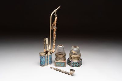 Two Chinese enamelled paktong opium pipes, an opium lamp and a cloisonné opium lamp, 19/20th C.