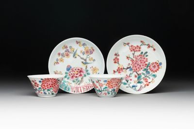 Two Chinese famille rose 'birds on flowering branches' cups and saucers, Yongzheng