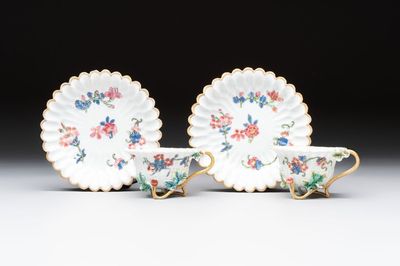 Two Chinese gilt-decorated famille rose cups and saucers with floral design, Qianlong