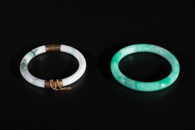 Two Chinese jadeite bracelets, one with 14K gold mounts, 19/20th C.