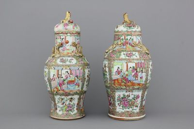 Two Chinese porcelain Canton vases and covers, 19th C.
