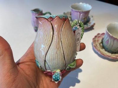 Two Chinese relief-decorated famille rose 'lotus' cups and saucers and two jugs, Yongzheng — photo 2