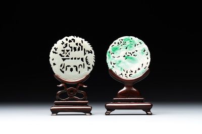 Two Chinese round jade plaques on carved wooden stands, 19th C.