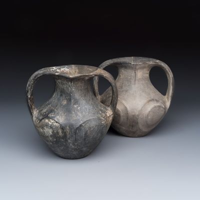 Two Chinese Sichuan black burnished pottery amphoras, Han