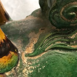 Two Chinese yellow and green-glazed 'horserider' roof tiles, Ming — 照片 21