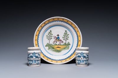Two Dutch Delft blue and white drug jars and a polychrome Brussels faience dish with a rider on horseback, 18th C.