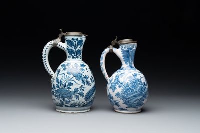 Two Dutch Delft blue and white jugs with pewter lids, 17/18th C.