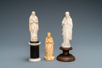 Two figures of Madonna and one of Christ in ivory and bone, 19th C.