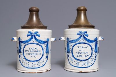 Two large blue and white Brussels faience tobacco jars with brass covers, 18th C.