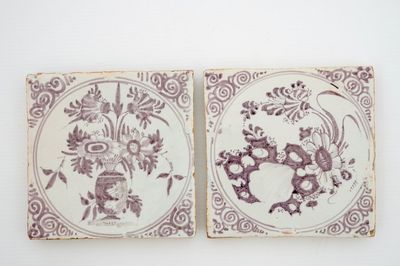 Two manganese Delftware tiles with floral decoration, Moustiers, France, 17th C.