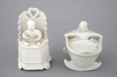 Two monochrome white Dutch Delft figures of children, 18th C.