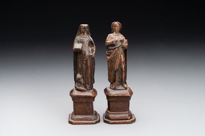 Two parcel-gilt and polychromed miniature oak sculptures of Saint John The Evangelist and Saint Catherine, 16th C.