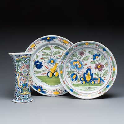 Two polychrome Dutch Delft dishes and a relief-moulded vase, 18th C.