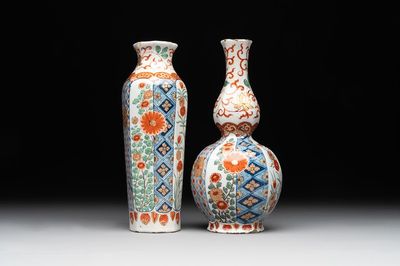 Two polychrome Dutch Delft petit feu vases with floral design, early 18th C.