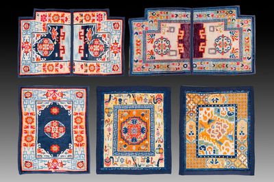 Two Tibetan saddle rugs and three small rugs, 19th C.