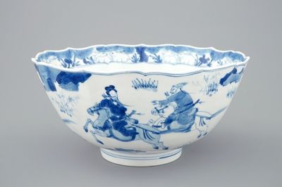 Un bol en porcelaine de Chine bleu et blanc à décor de cavaliers, Kangxi