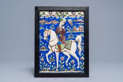 Un carreau rectangulaire à décor d'un prince sur cheval, art qajar, Iran, 19ème