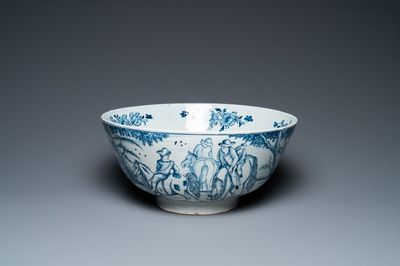 Un grand bol en faïence de Delft en bleu et blanc à décor de bergers sur chevaux, 18ème