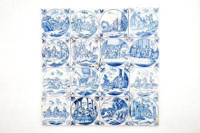 Un lot de 16 carreaux religieux en faïence de Delft bleu et blanc avec oeillets, 18ème