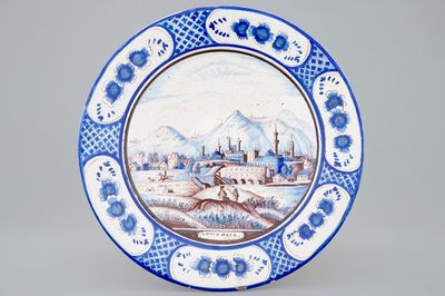 Un plat en bleu, blanc et manganèse au décor d'un paysage, Harlingen, la Frise, 19ème