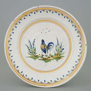 Un plat polychrome en faïence de Bruxelles décoré d'un coq, 18ème — photo 1