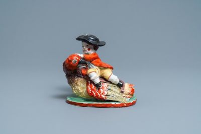 Une boîte couverte en forme d'un garçon sur un oiseau en faïence de Delft polychrome, 18ème
