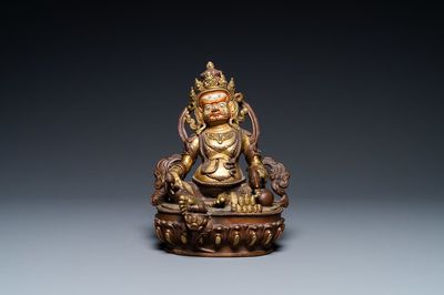 Une figure de Jambhala en bronze partiellement doré au dos inscrit, Sino-Tibet, 19ème