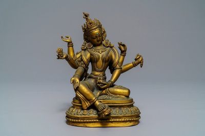 Une figure de Vasudhara en bronze doré incrusté, Tibet ou Népal, 18/19ème